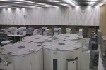 Storage Tek tape library in the foreground, Linux PCs in the background, SGI/Cray boxes on the left.